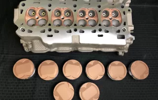Heads and pistons coated by IA Coatings